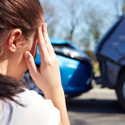 Concerned driver with defocused traffic accident