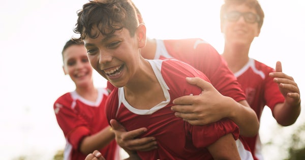 A soccer player celebrates a goal.